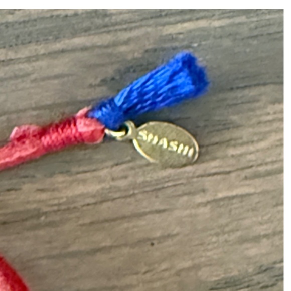 Shashi red leather wrap bracelet with beaded center - Picture 2 of 6